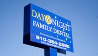 Photo of the Day & Night Dental sign in front of the office